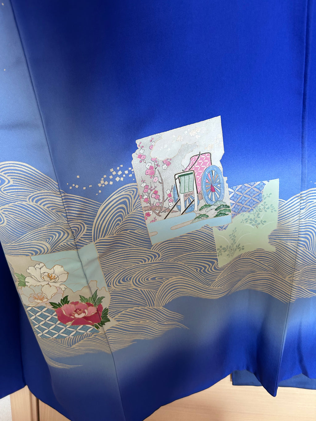 Close-up of Gosho Guruma cart motif on vintage Japanese silk haori