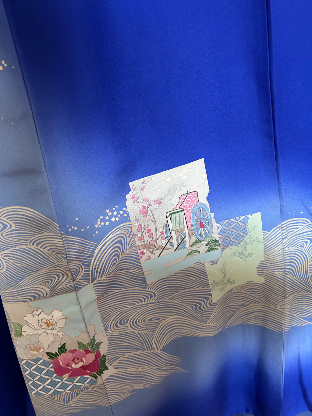 Close-up of traditional Japanese floral and wave motifs on vintage silk haori