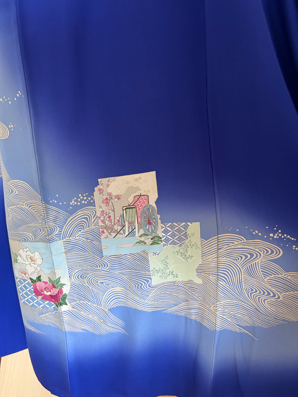 Close-up of traditional Japanese floral and wave motifs on vintage silk haori