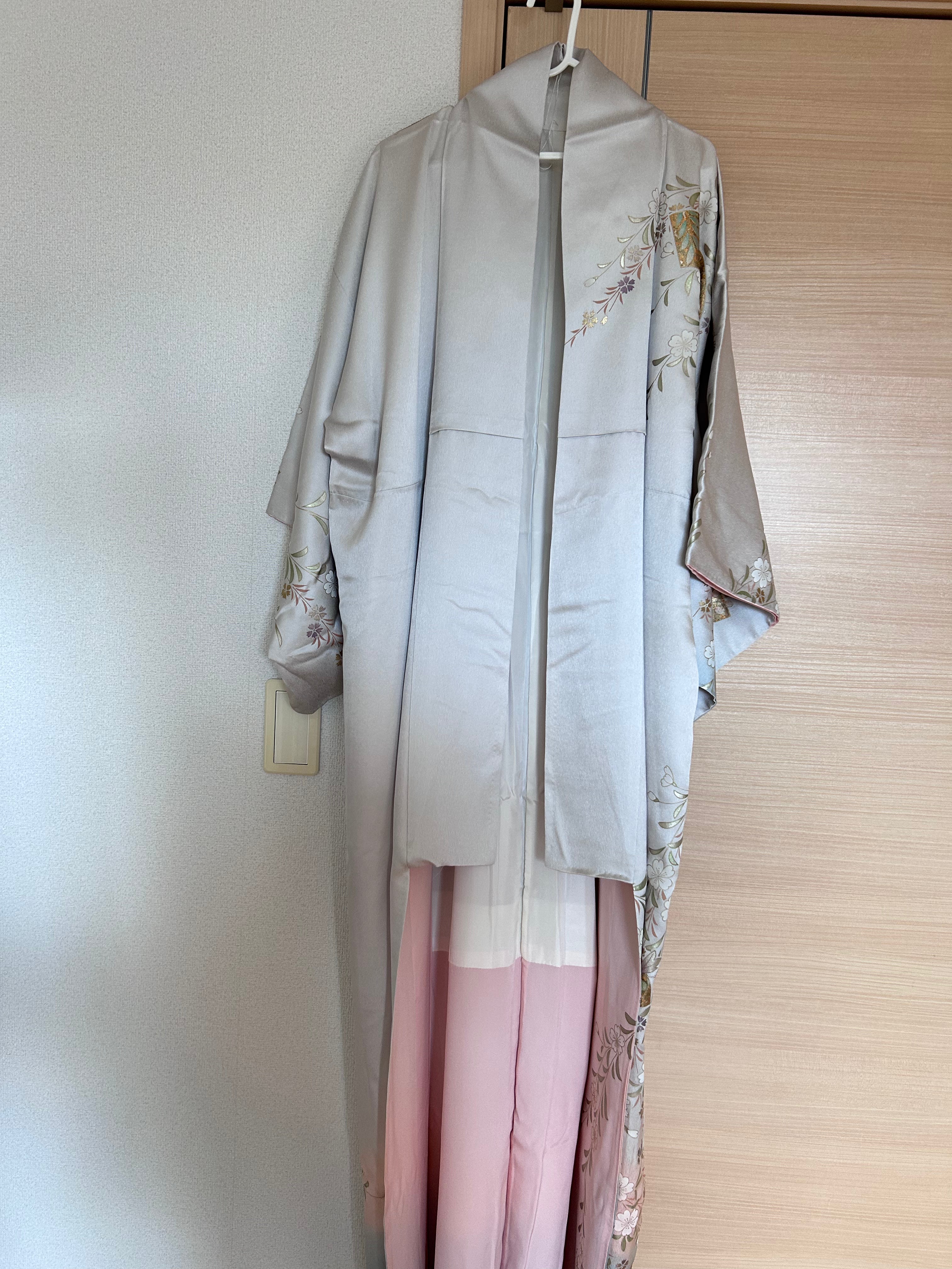 Vintage Japanese silk haori in soft silver with sakura and fan motifs - front view 